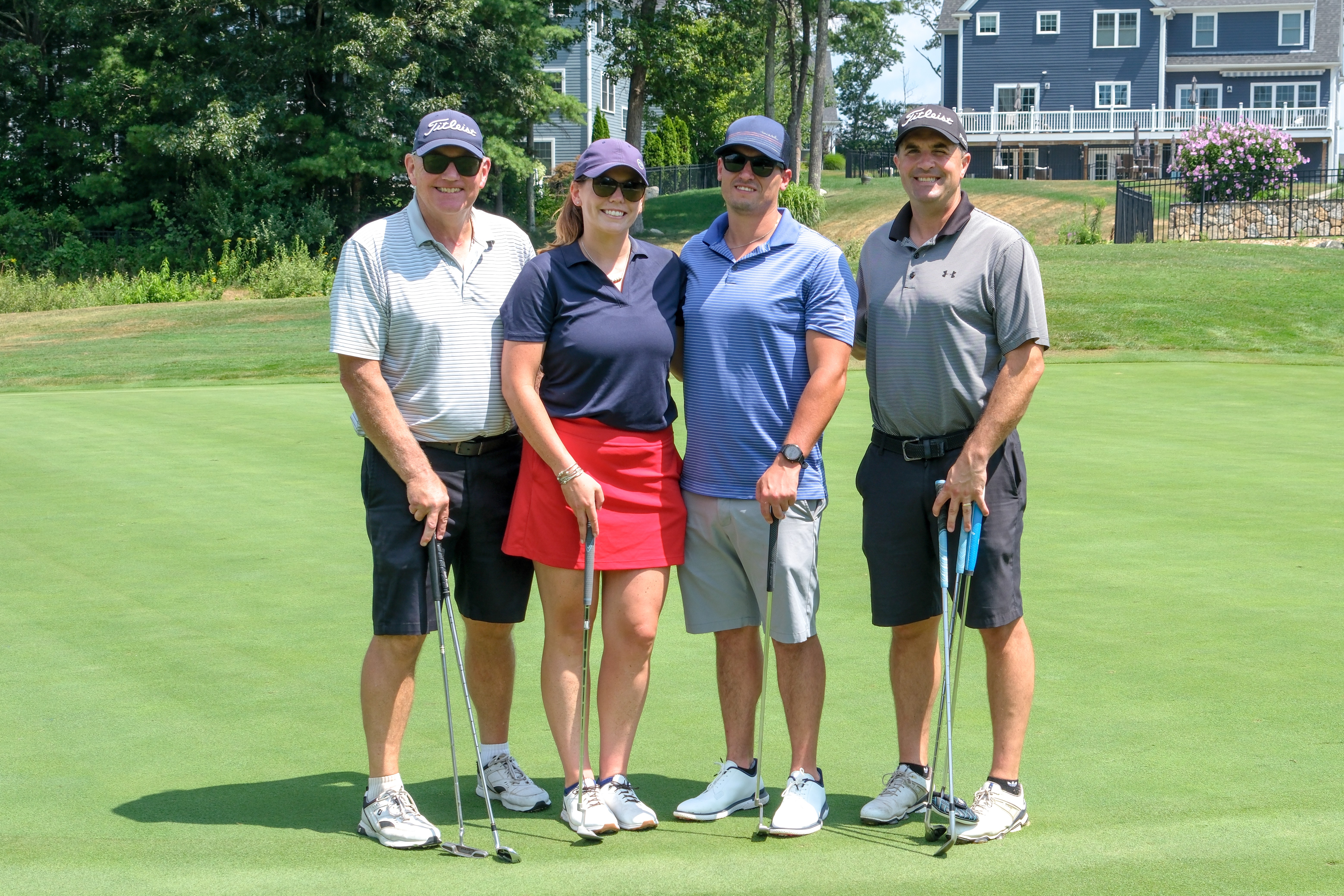 Golfers smiling at camera
